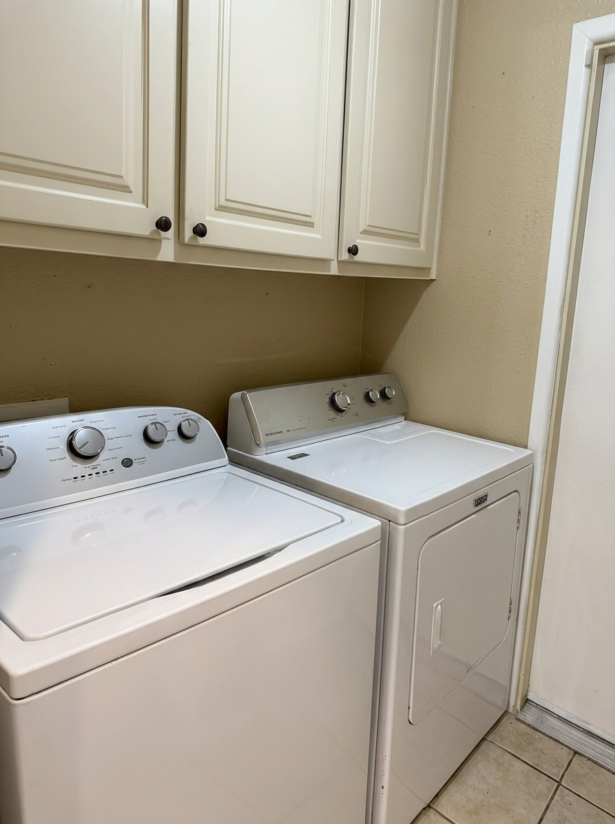 Laundry room with full-size washer and dryer